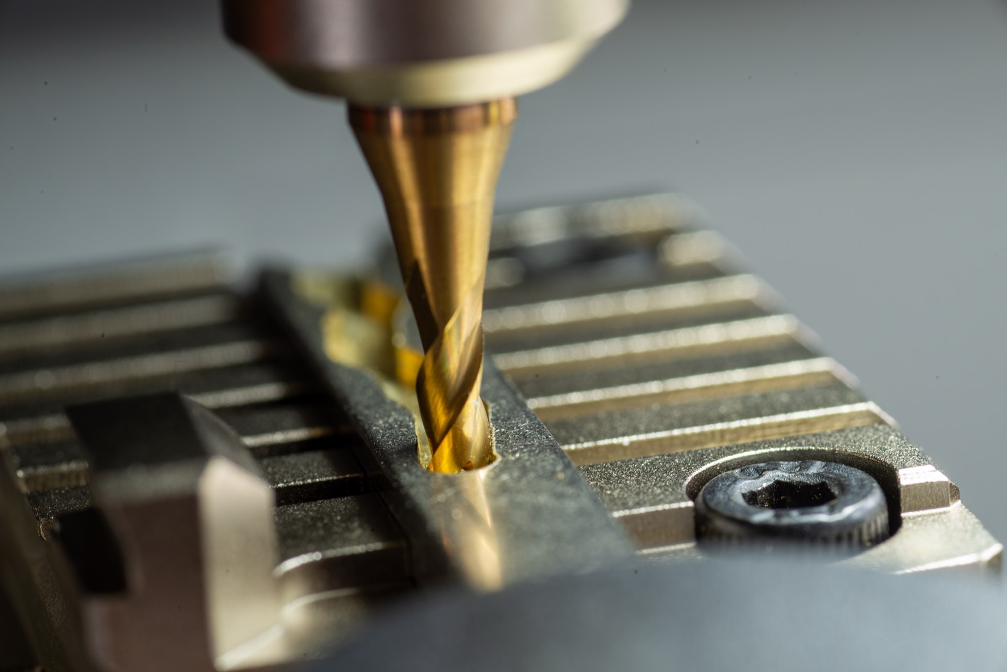 Macro view of a key duplication cutter working on a key.